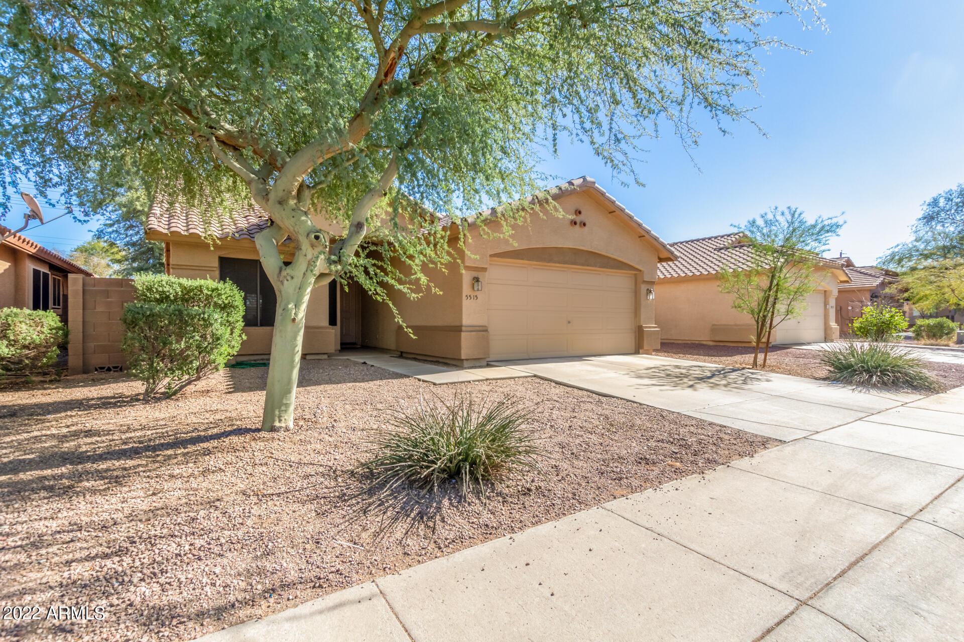 5515 South 15th Way Phoenix, AZ 85040 - Photo 3 of 28 a house with a tree in front of it