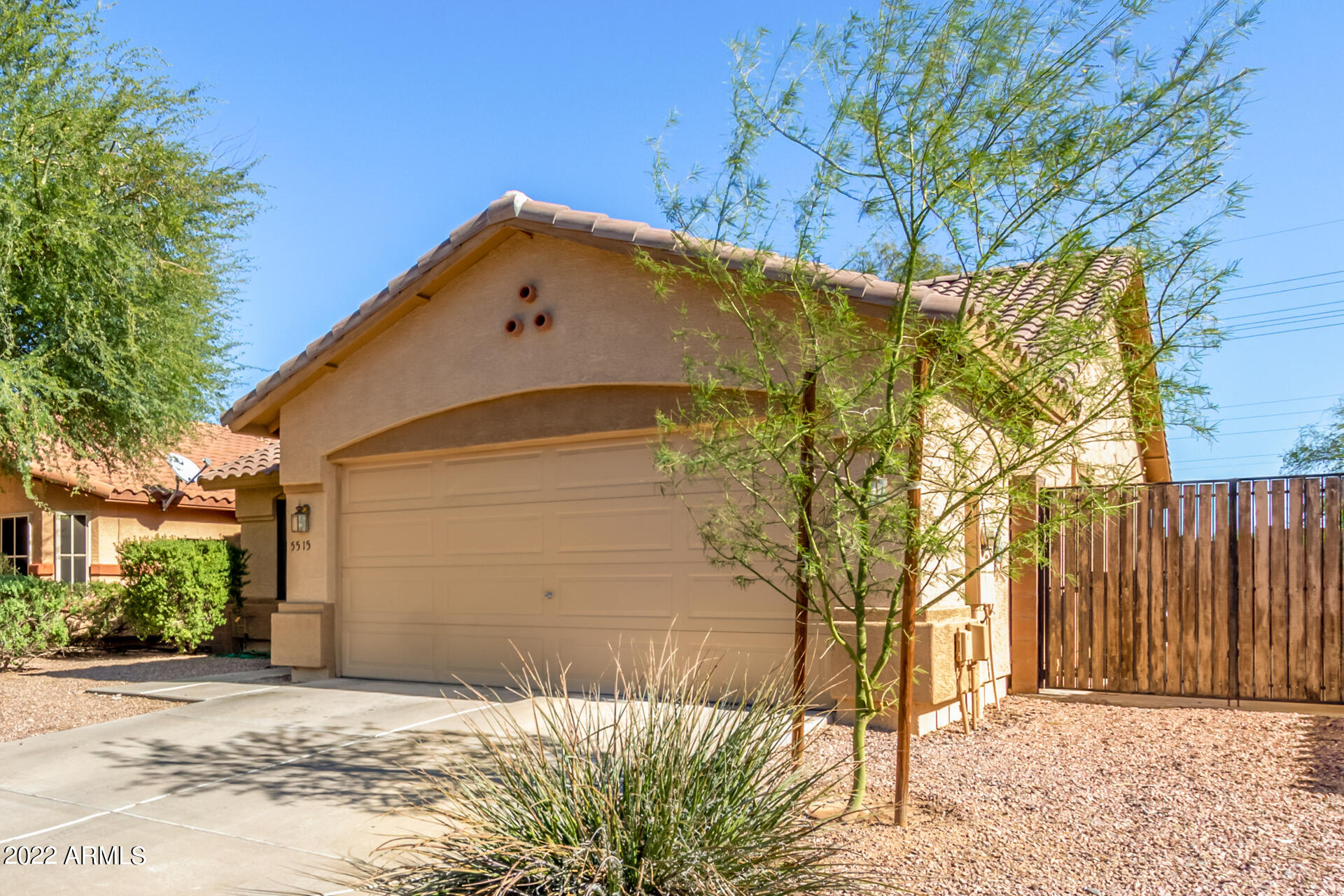 5515 South 15th Way Phoenix, AZ 85040 - Photo 6 of 28 a front view of a house with a yard