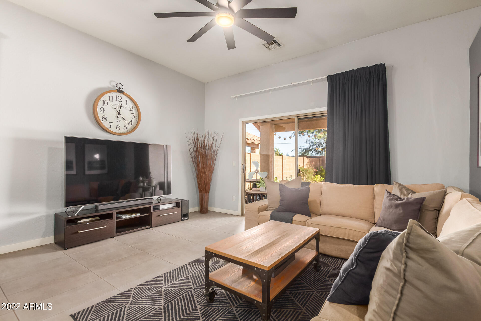 5515 South 15th Way Phoenix, AZ 85040 - Photo 9 of 28 a living room with furniture and a flat screen tv