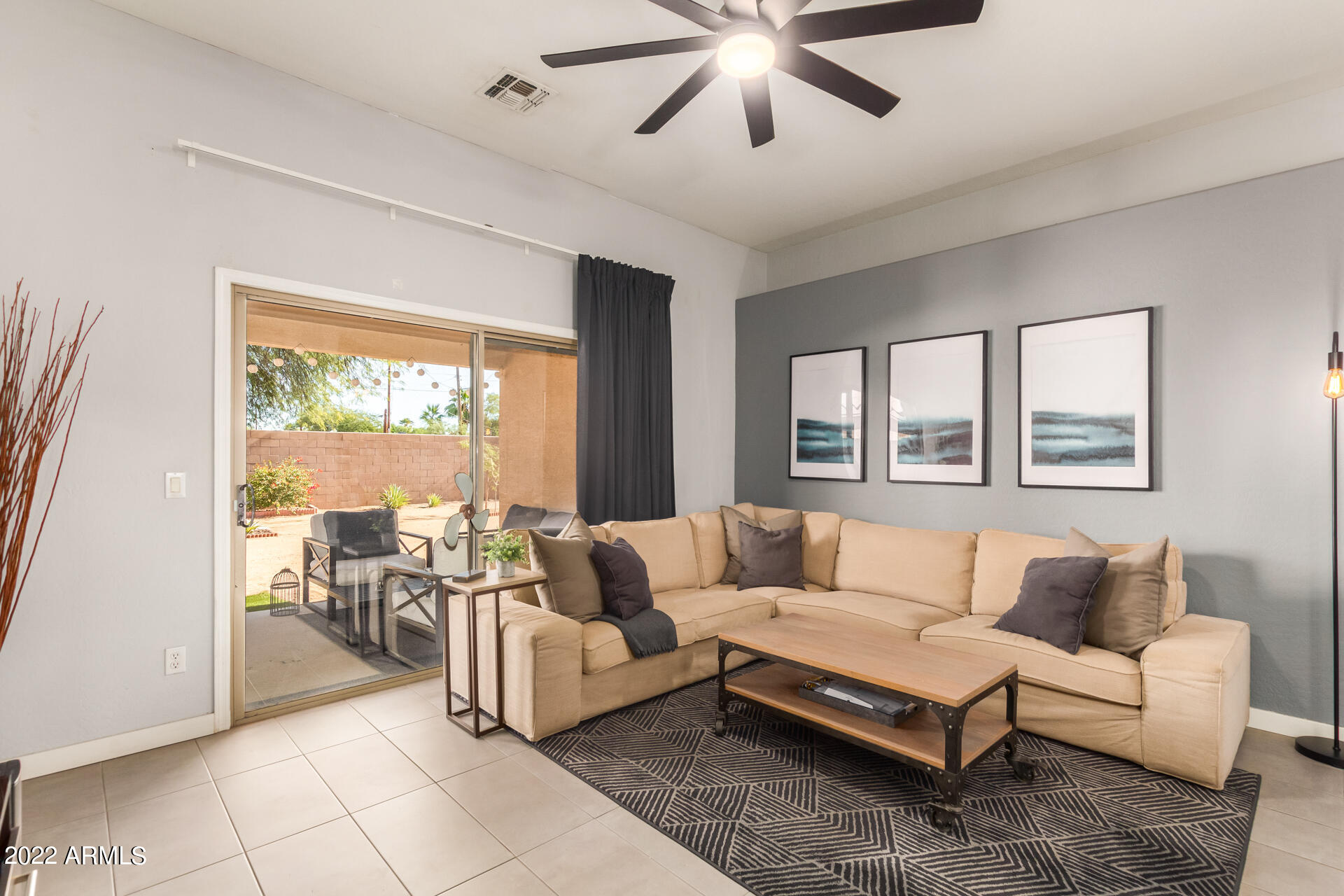 5515 South 15th Way Phoenix, AZ 85040 - Photo 10 of 28 a living room with furniture and a large window