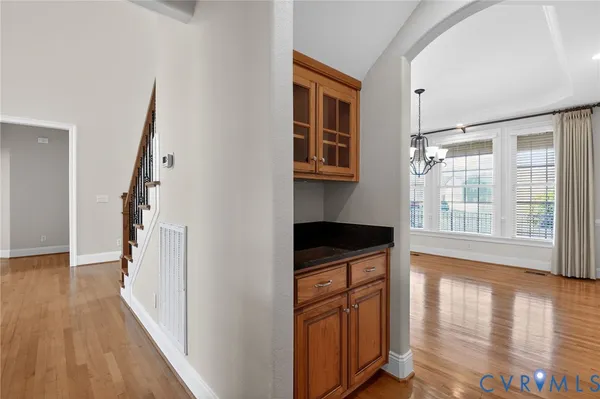 a view of an empty room with a ceiling fan