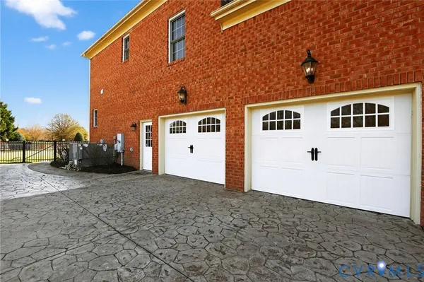 a view of a kitchen with wooden floor and electronic appliances