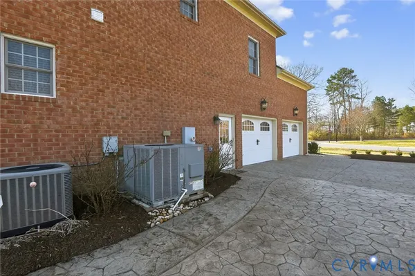 a bathroom with a tub a sink and a window