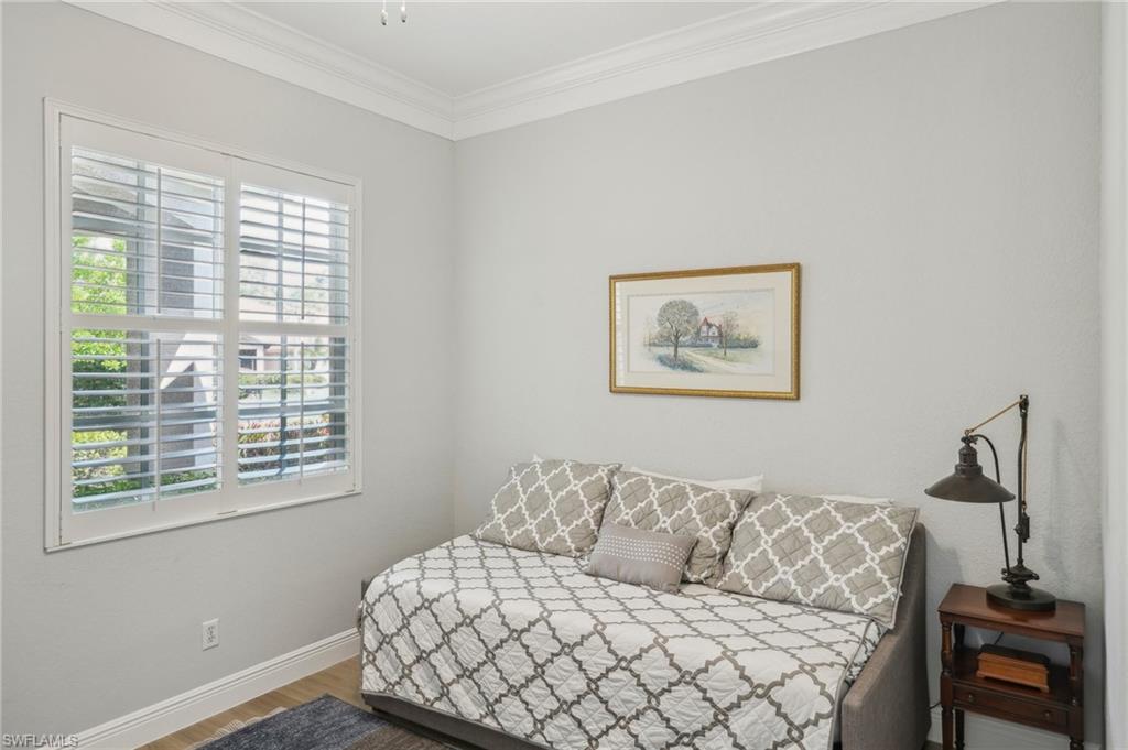 3653 Periwinkle Way Naples, FL 34114 - Photo 26 of 49 Bedroom with wood finished floors and ornamental molding