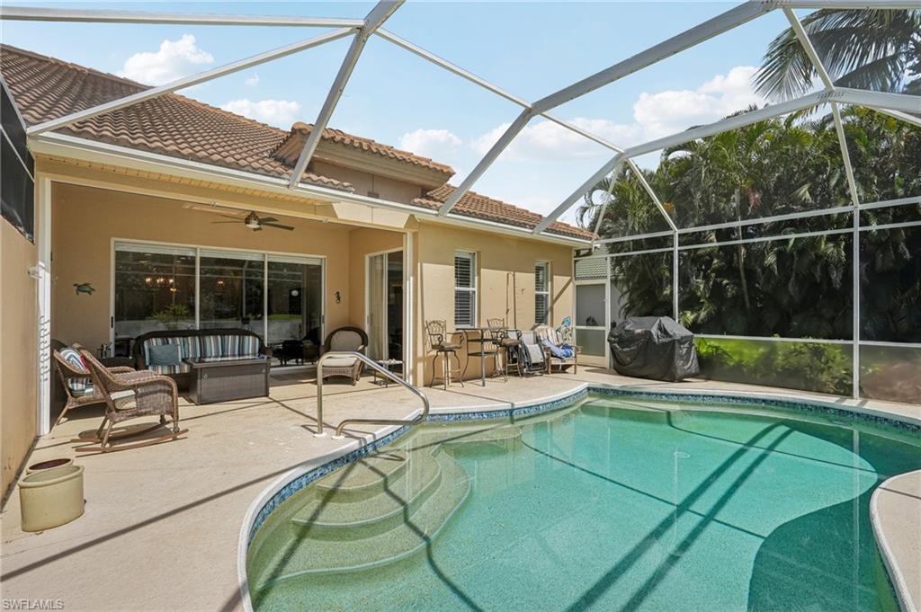 3653 Periwinkle Way Naples, FL 34114 - Photo 32 of 49 Swimming pool featuring a patio, a sunroom, outdoor lounge area, ceiling fan, and area for grilling