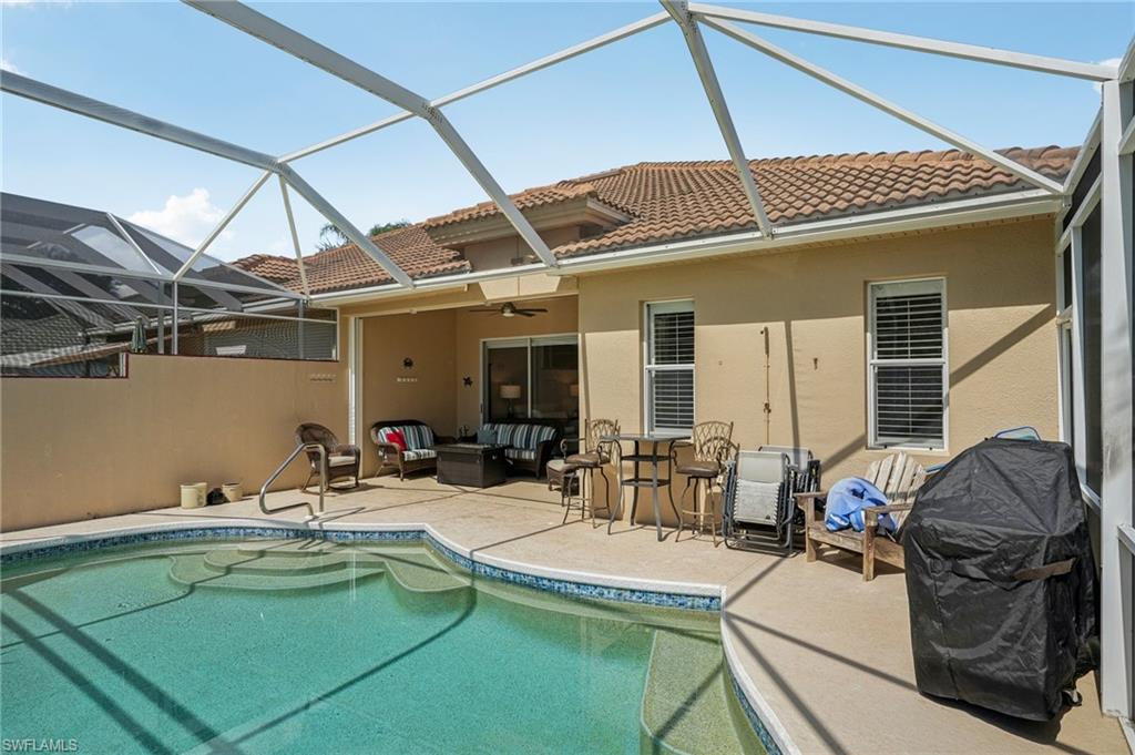 3653 Periwinkle Way Naples, FL 34114 - Photo 33 of 49 Swimming pool with an outdoor hangout area, a ceiling fan, area for grilling, a sunroom, and a patio area