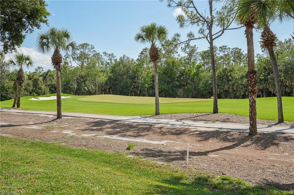 3653 Periwinkle Way Naples, FL 34114 - Photo 36 of 49 Surrounding community featuring a yard, golf course view, and view of scattered trees