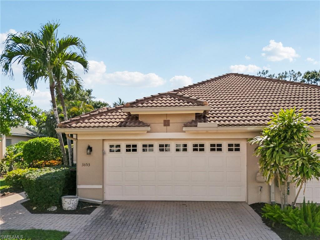 3653 Periwinkle Way Naples, FL 34114 - Photo 37 of 49 Mediterranean / spanish house with stucco siding, a tile roof, and decorative driveway