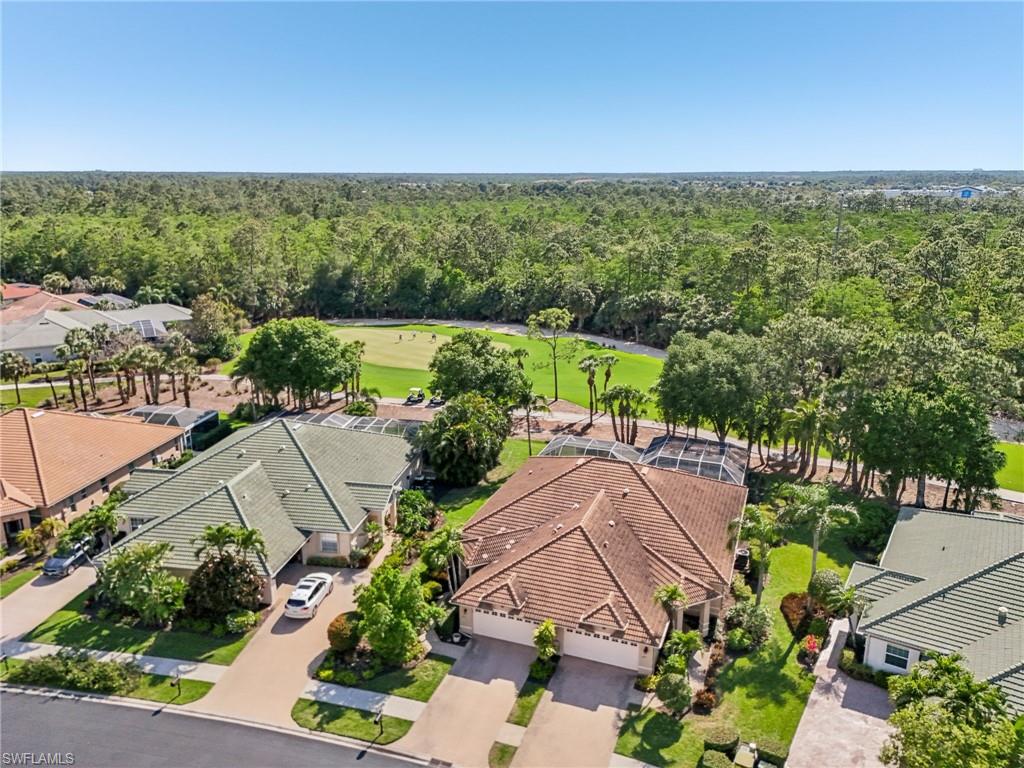3653 Periwinkle Way Naples, FL 34114 - Photo 39 of 49 Aerial perspective of suburban area featuring a local golf course