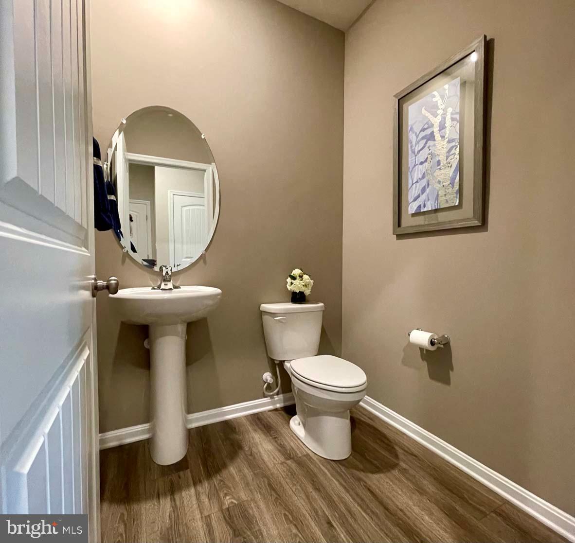 1145 Wintermead Loop Salisbury, MD 21801 - Photo 11 of 51 a bathroom with a toilet and a mirror