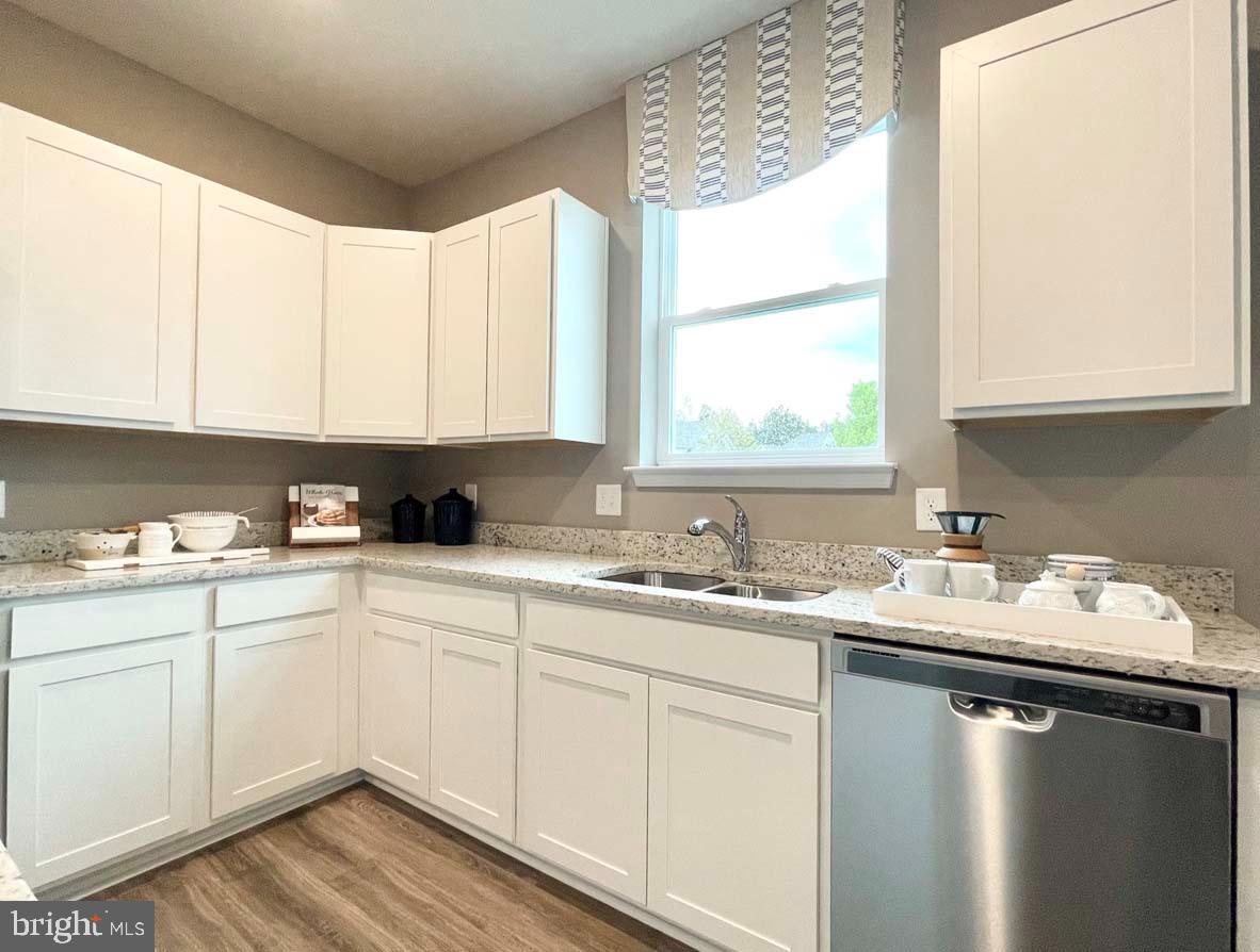 1145 Wintermead Loop Salisbury, MD 21801 - Photo 20 of 51 a kitchen with a sink window and cabinets