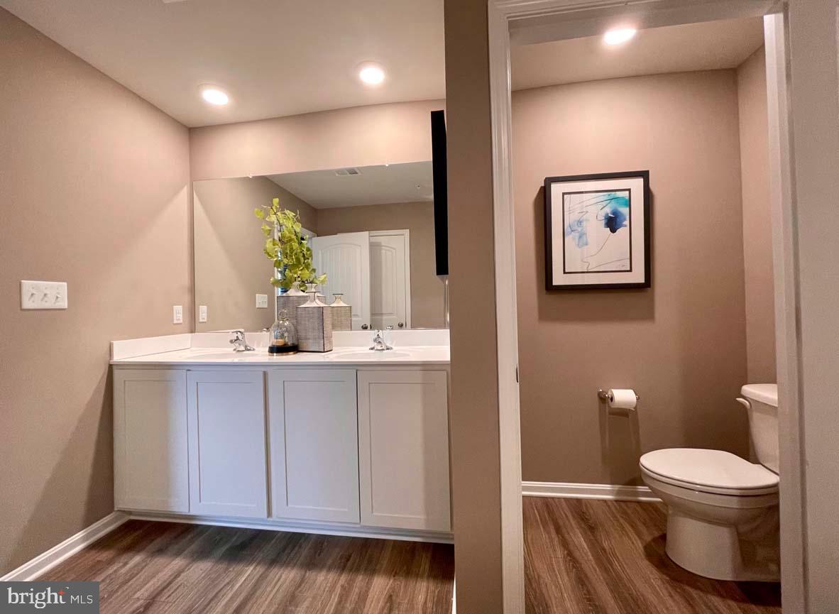 1145 Wintermead Loop Salisbury, MD 21801 - Photo 35 of 51 a bathroom with a toilet sink and mirror