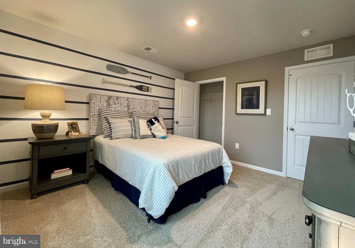 1145 Wintermead Loop Salisbury, MD 21801 - Photo 45 of 51 a bedroom with a bed and a television