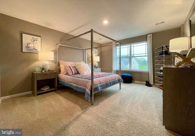 a bedroom with a bed and a cabinets