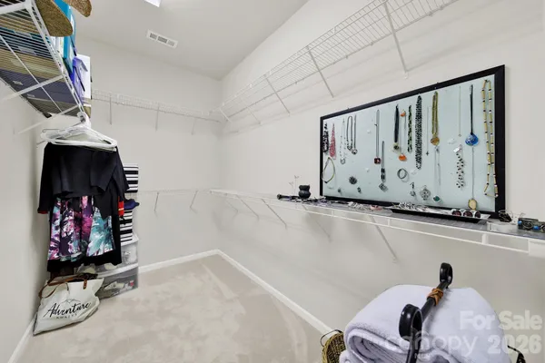 a view of a room with lots of stuff and hardwood floor