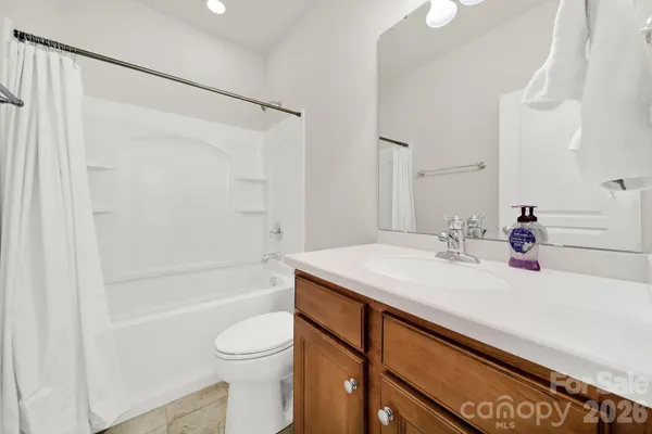 a bathroom with a sink a toilet and a bathtub