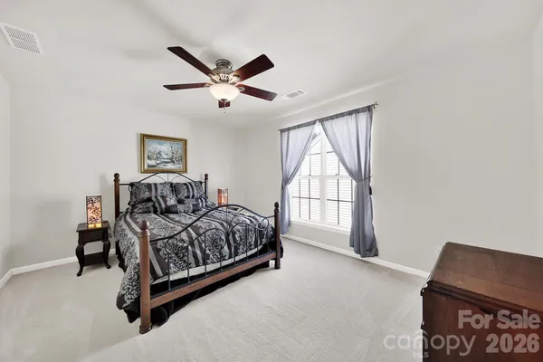 a bed room with a bed and a window