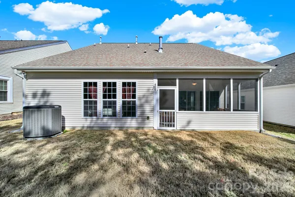 a view of a house with wooden floor and a large window