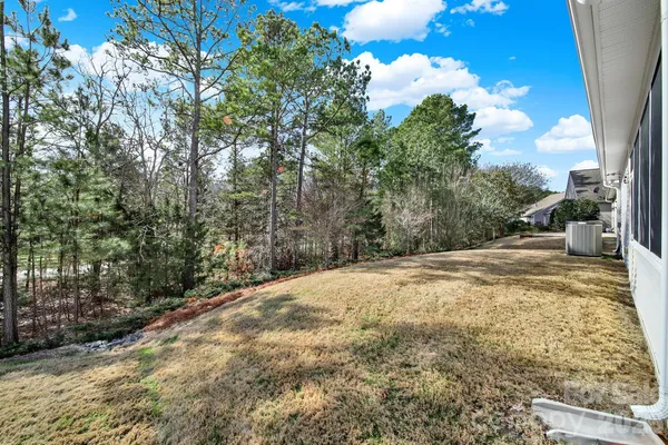 a view of a backyard of the house