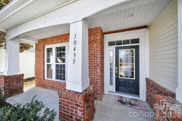 a balcony view with a seating space