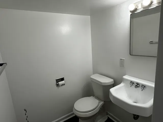 a bathroom with a glass shower door