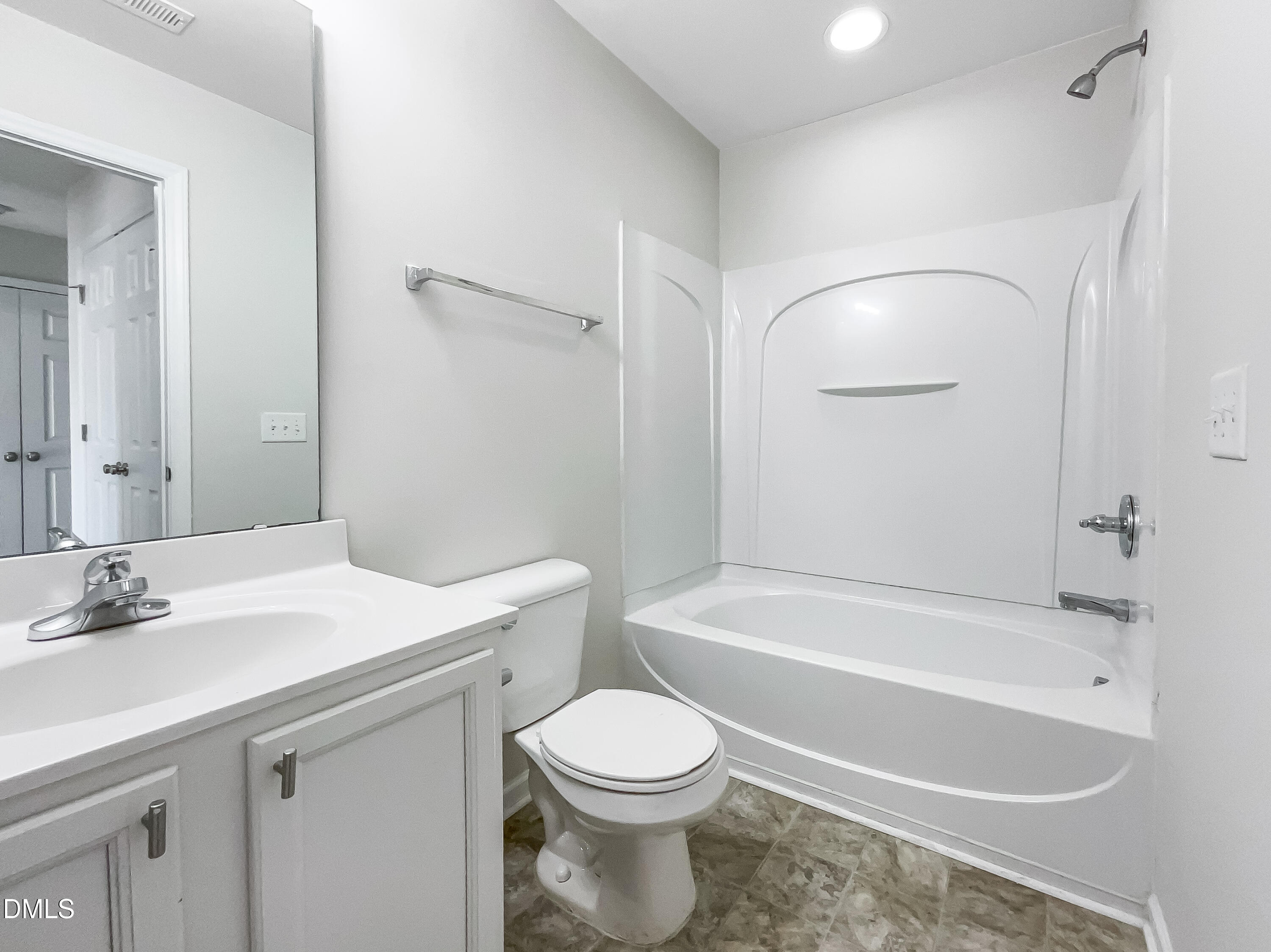 5107 Sandy Banks Road Raleigh, NC 27616 - Photo 19 of 21 a bathroom with a sink a toilet and a bathtub