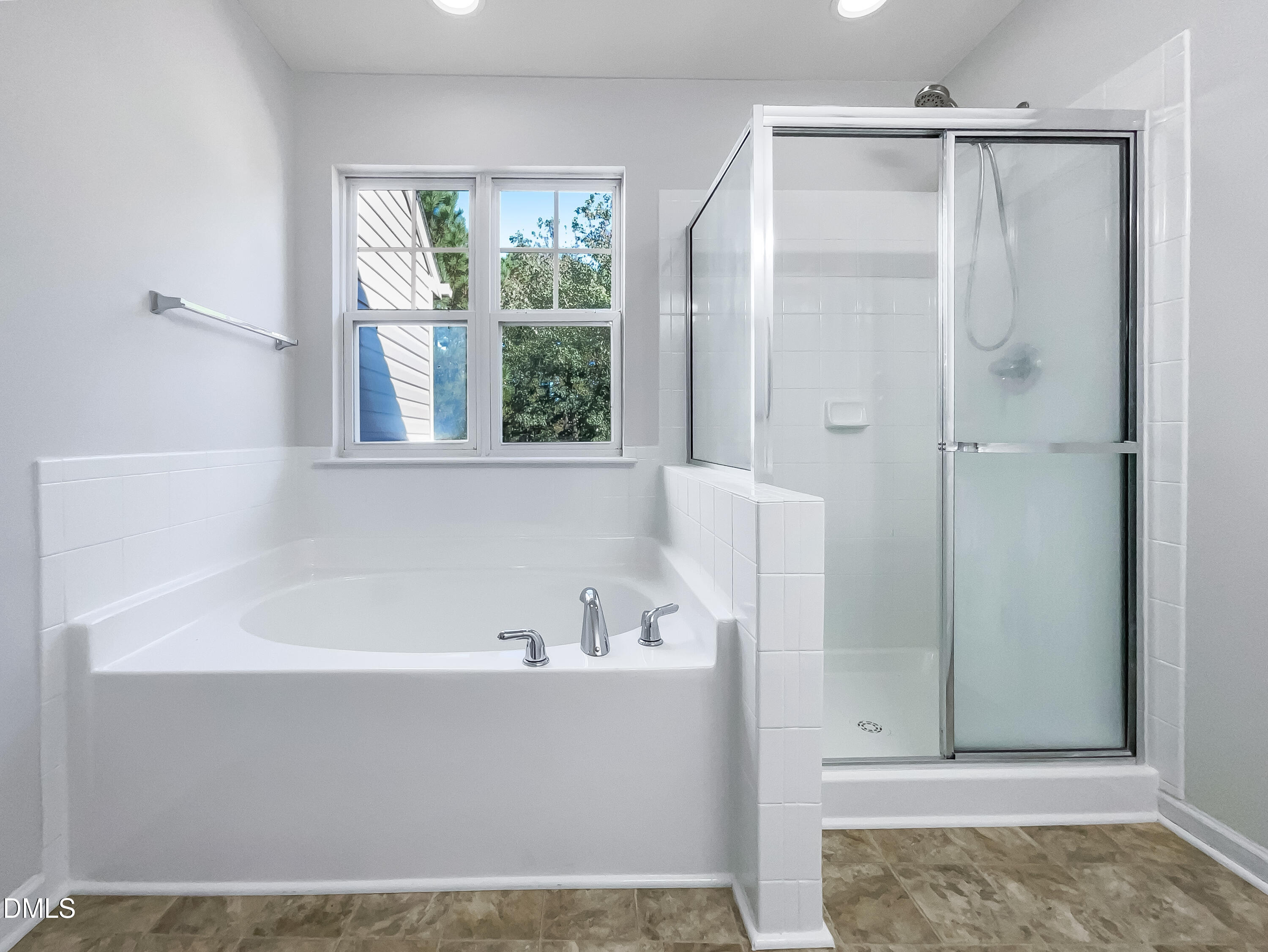 5107 Sandy Banks Road Raleigh, NC 27616 - Photo 10 of 21 a bathroom with a bathtub and a shower