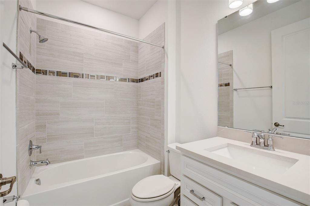 12918 Brookside Moss Drive Riverview, FL 33579 - Photo 19 of 43 a bathroom with a sink toilet and shower