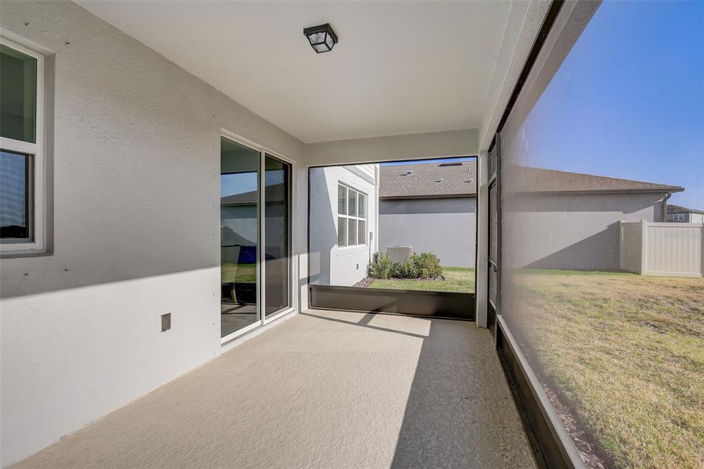 12918 Brookside Moss Drive Riverview, FL 33579 - Photo 43 of 43 a bedroom with a bed and a large window