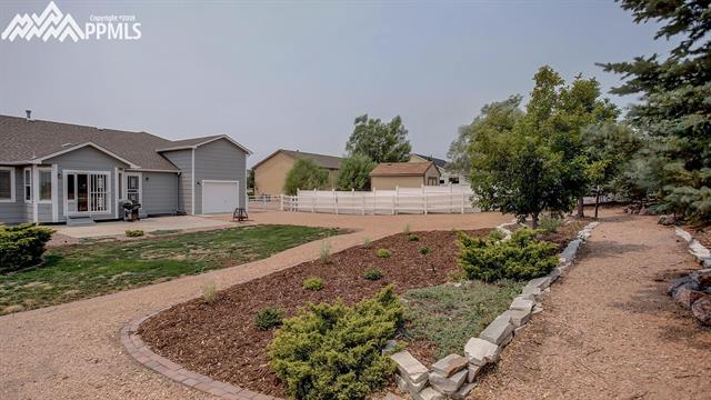 9232 Rockingham Drive Peyton, CO 80831 - Photo 30 of 35 View of huge backyard. Notice garage door for access to anything you need.