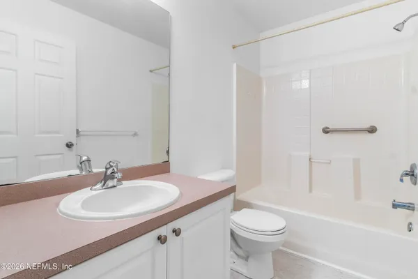 a bathroom with a sink toilet and a bathtub