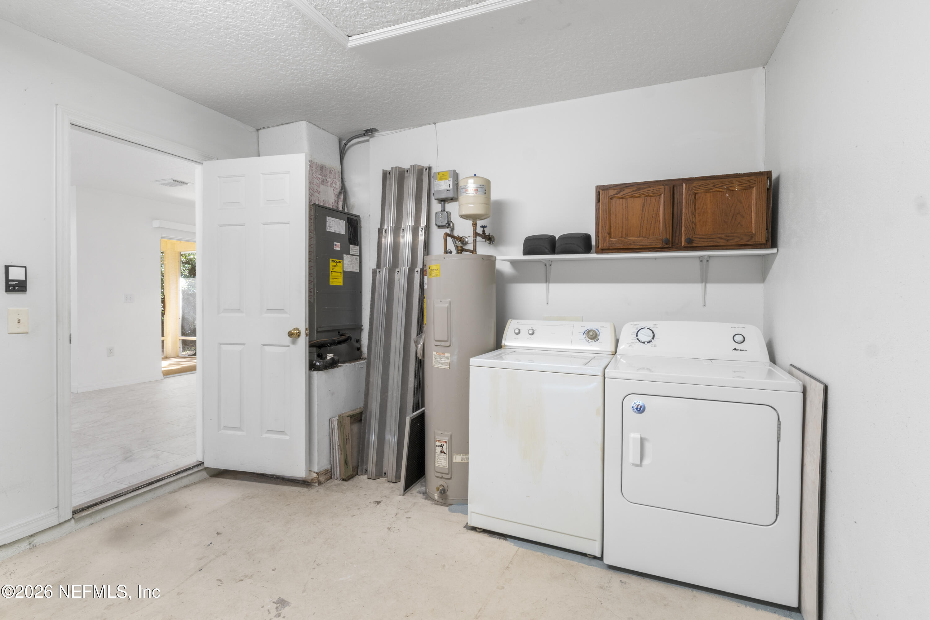 1022 Foster Road Sebastian, FL 32958 - Photo 19 of 30 a utility room with dryer and washer