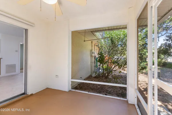 a view of an empty room with a window