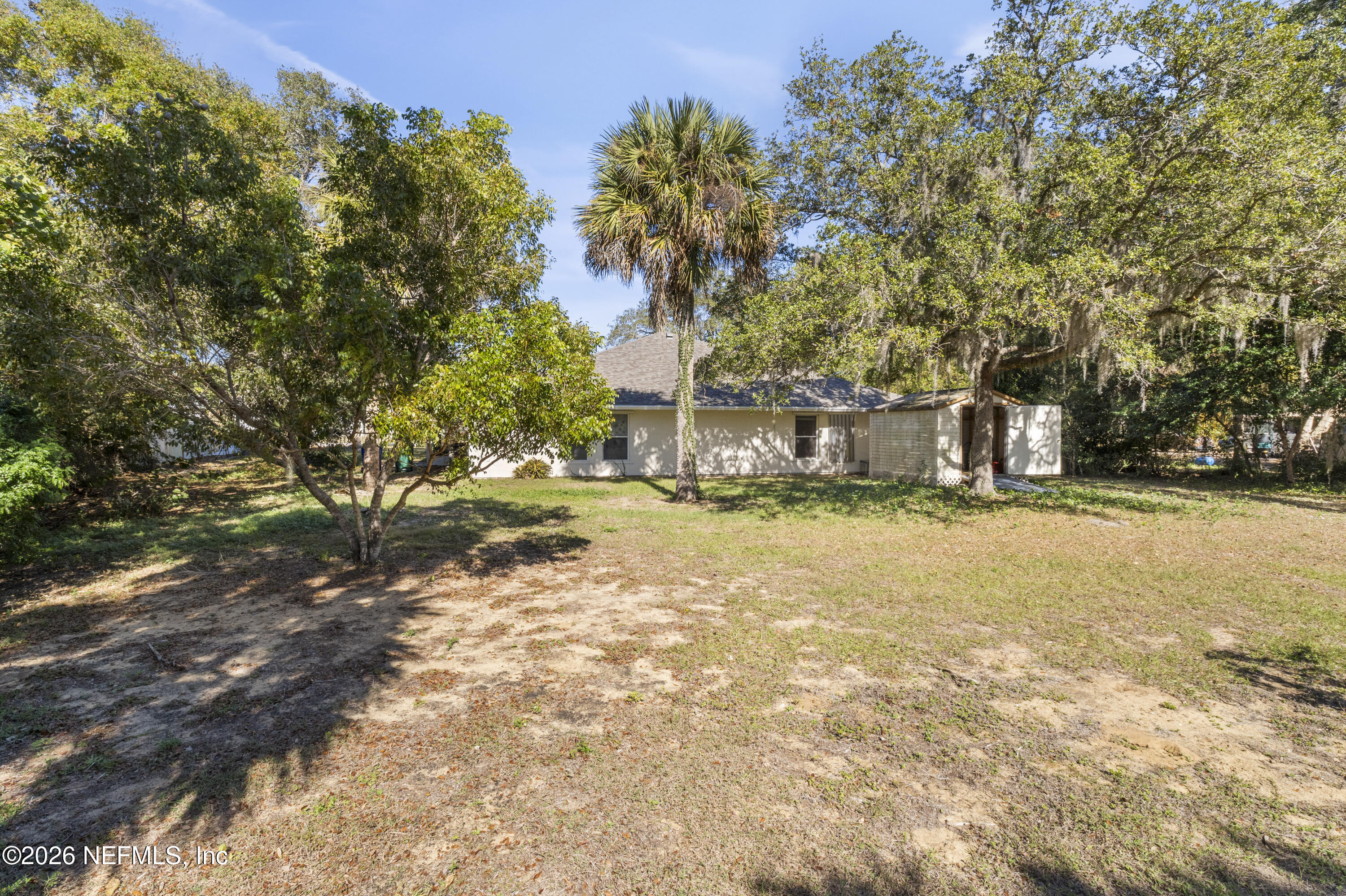 1022 Foster Road Sebastian, FL 32958 - Photo 30 of 30 a house with trees in front of it