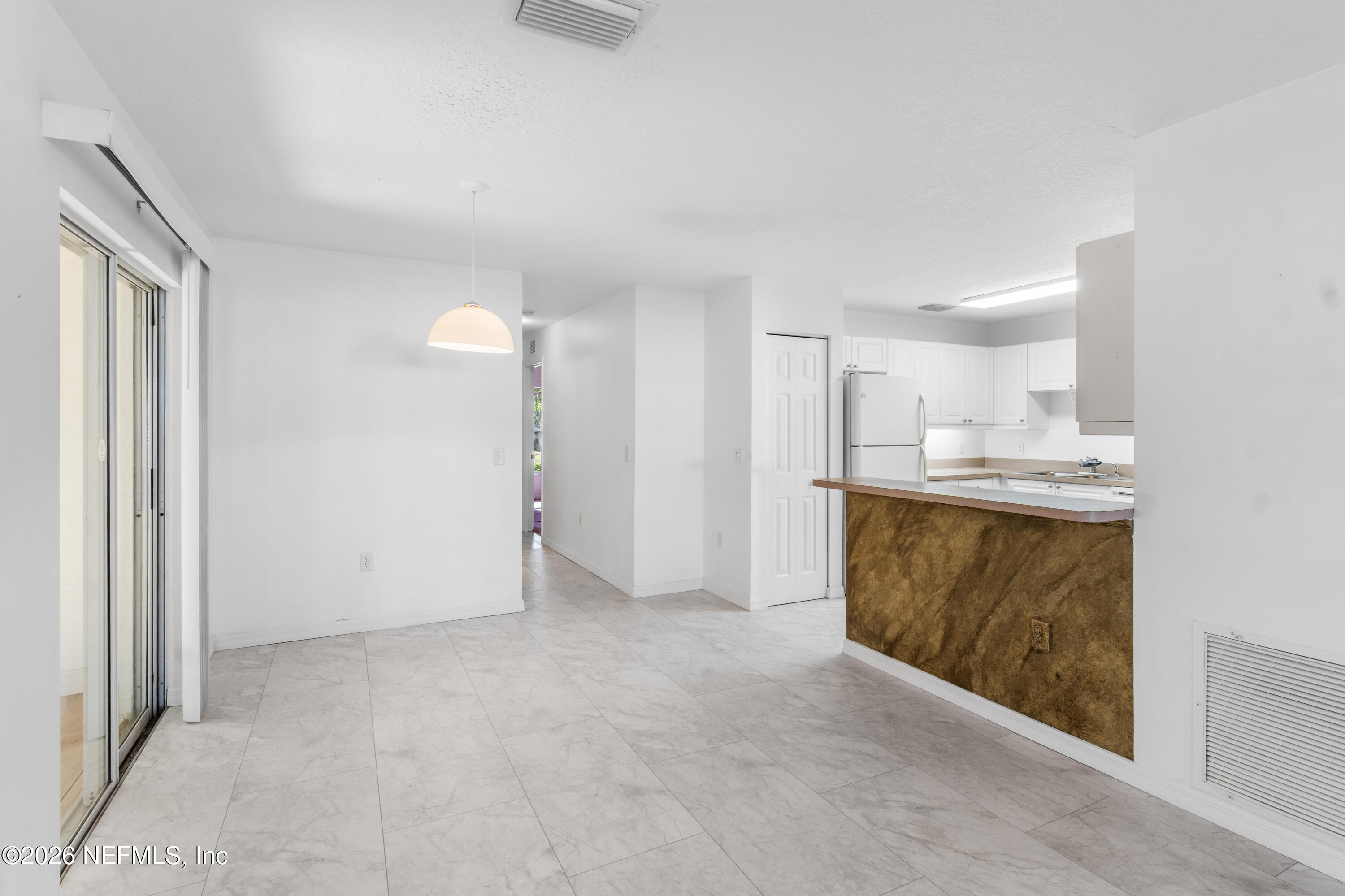 1022 Foster Road Sebastian, FL 32958 - Photo 5 of 30 a view of kitchen cabinets and wooden floor