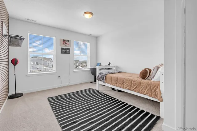 a view of a bedroom with furniture