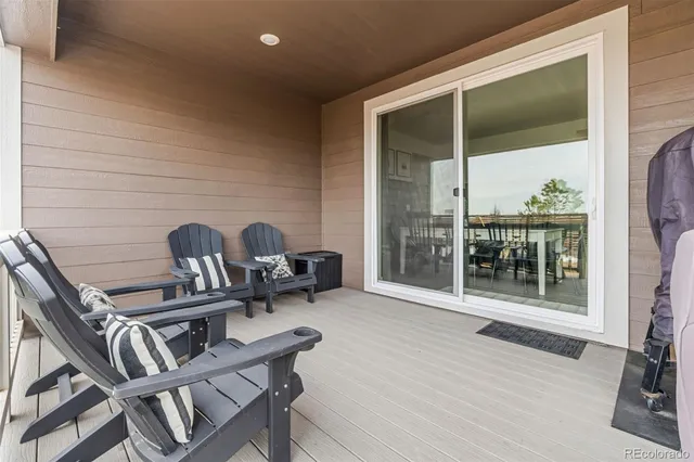 a front view of a building with glass top table and chairs
