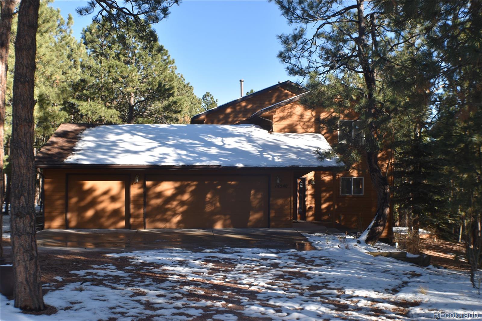 14540 Rosholt Loop Colorado Springs, CO 80921 - Photo 2 of 50 a view of a backyard with a tree