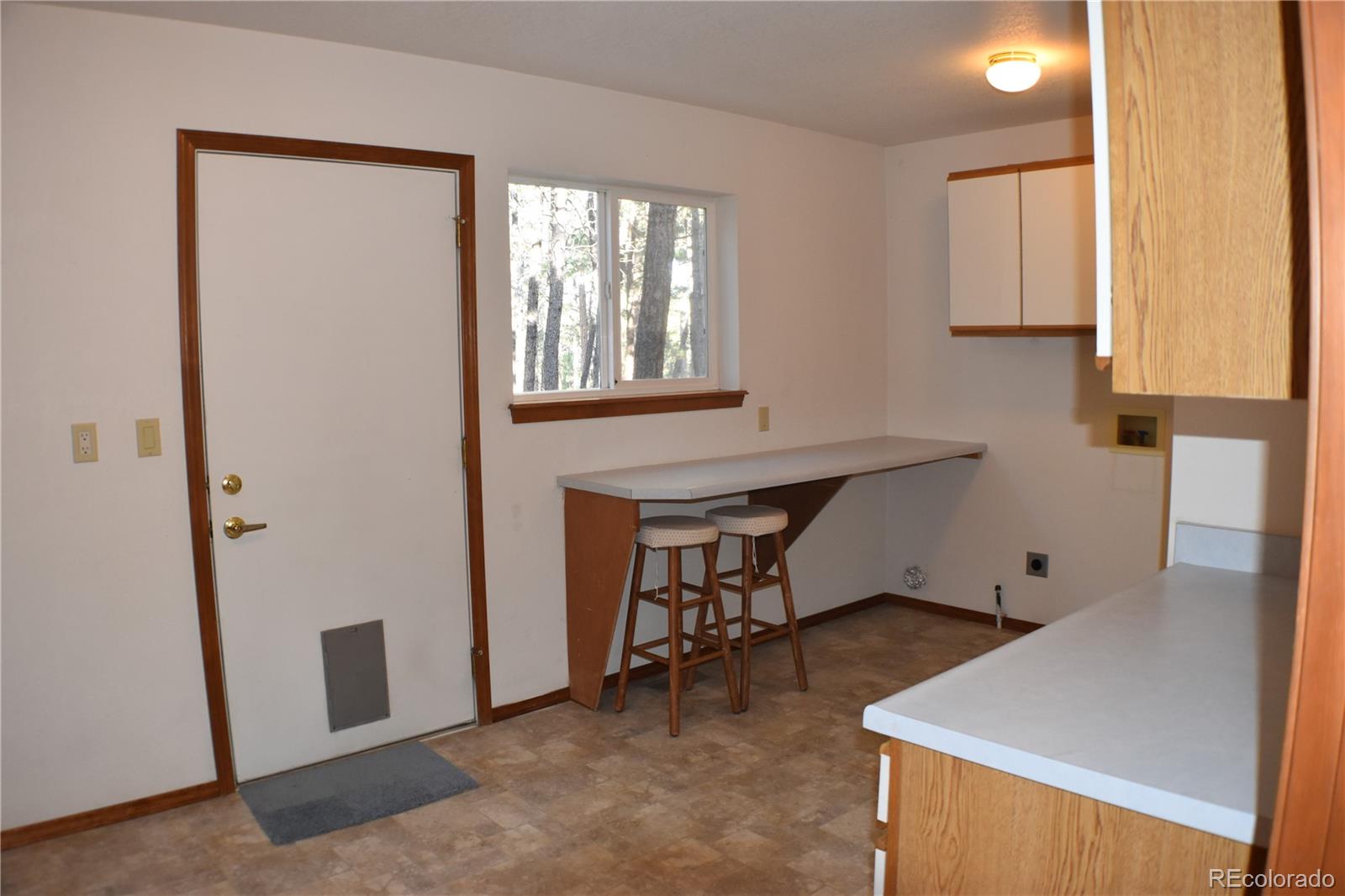 14540 Rosholt Loop Colorado Springs, CO 80921 - Photo 21 of 50 a workspace with furniture and window