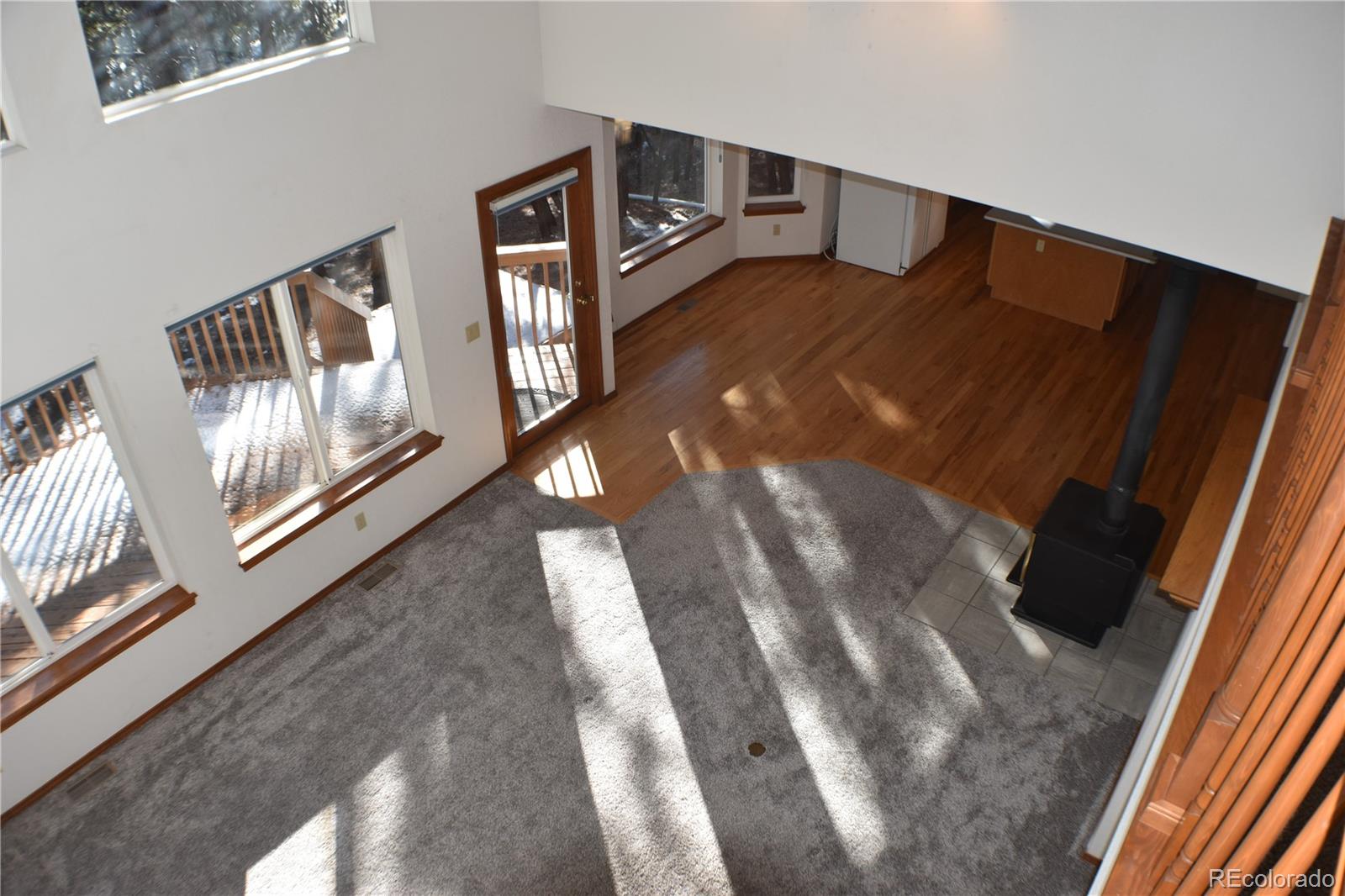 14540 Rosholt Loop Colorado Springs, CO 80921 - Photo 28 of 50 a view of an entryway with wooden floor