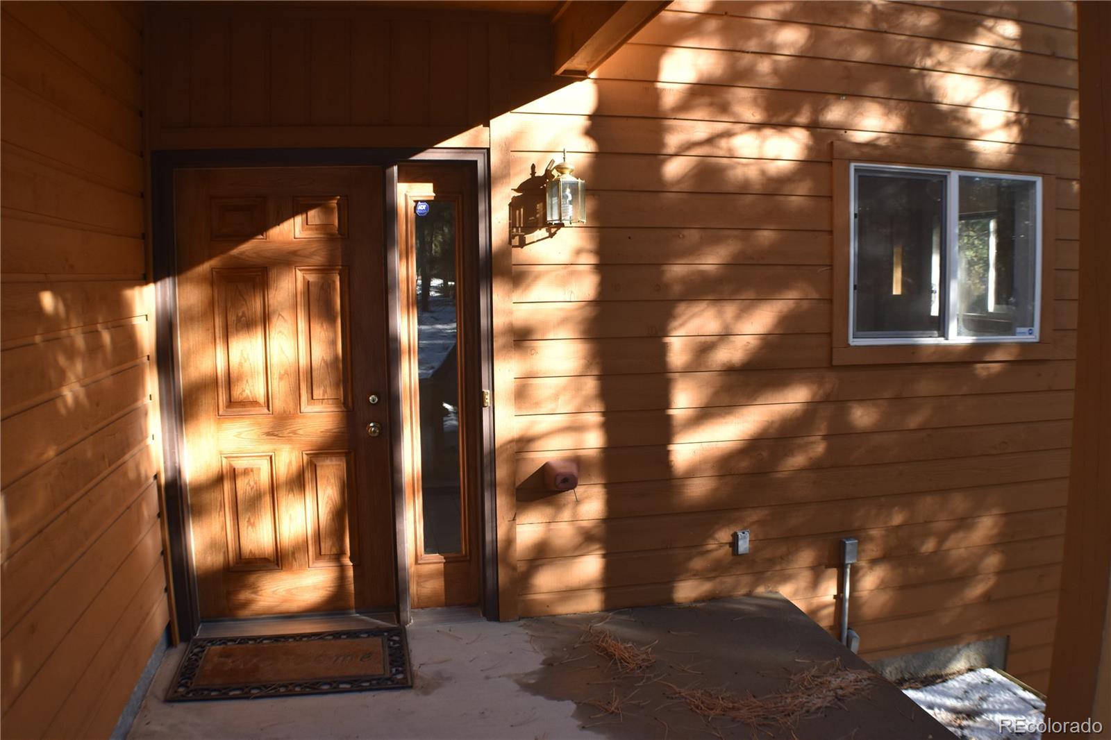 14540 Rosholt Loop Colorado Springs, CO 80921 - Photo 3 of 50 a view of a glass door with glass windows
