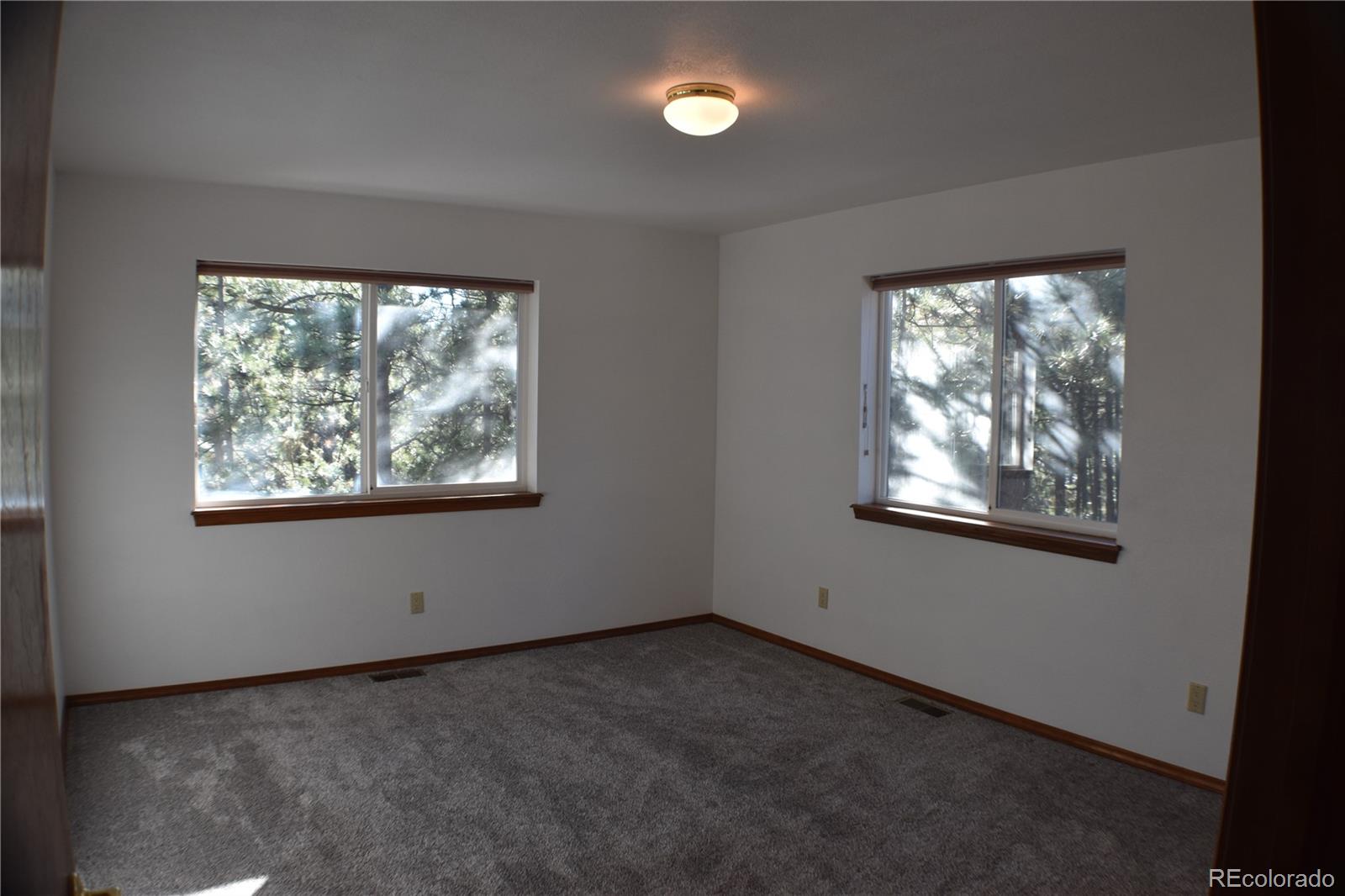 14540 Rosholt Loop Colorado Springs, CO 80921 - Photo 37 of 50 an empty room with a window