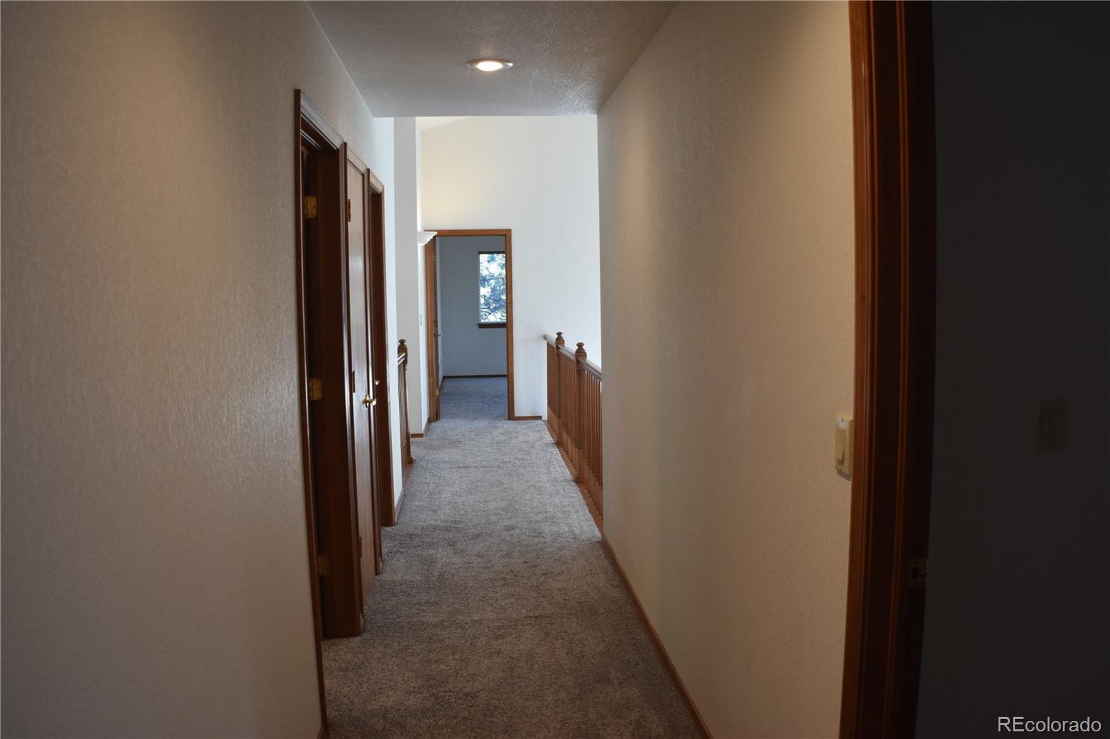 14540 Rosholt Loop Colorado Springs, CO 80921 - Photo 40 of 50 a view of a hallway with a hallway