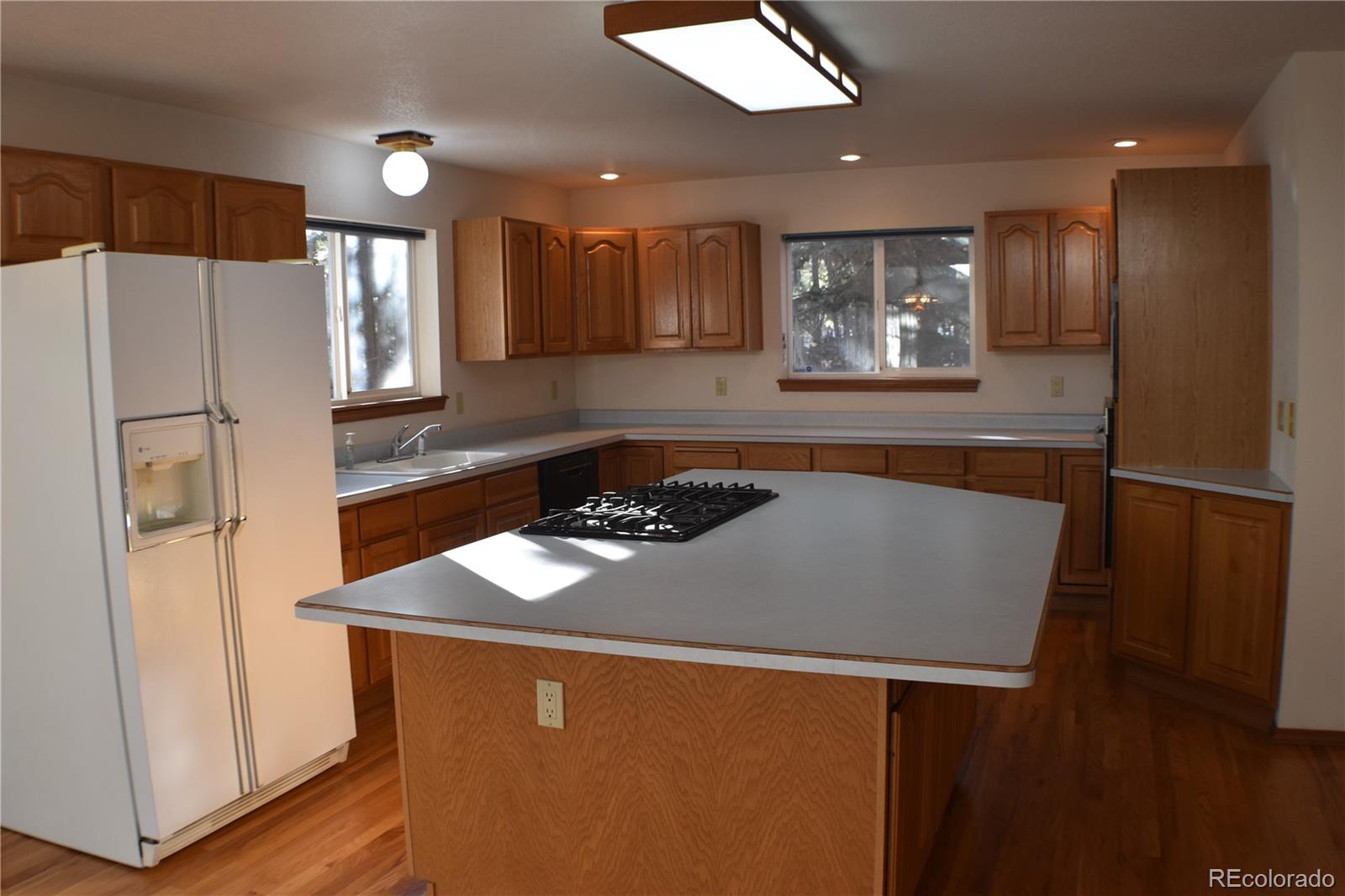 14540 Rosholt Loop Colorado Springs, CO 80921 - Photo 6 of 50 a kitchen with stainless steel appliances granite countertop refrigerator sink and stove