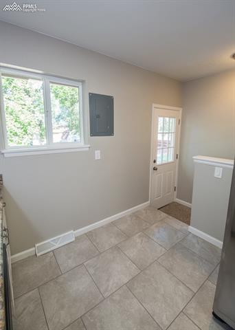 408 Placid Road Colorado Springs, CO 80910 - Photo 11 of 36 There is even a small nook area in the Kitchen that would make a great breakfast area! Notice the walk-out to the backyard.