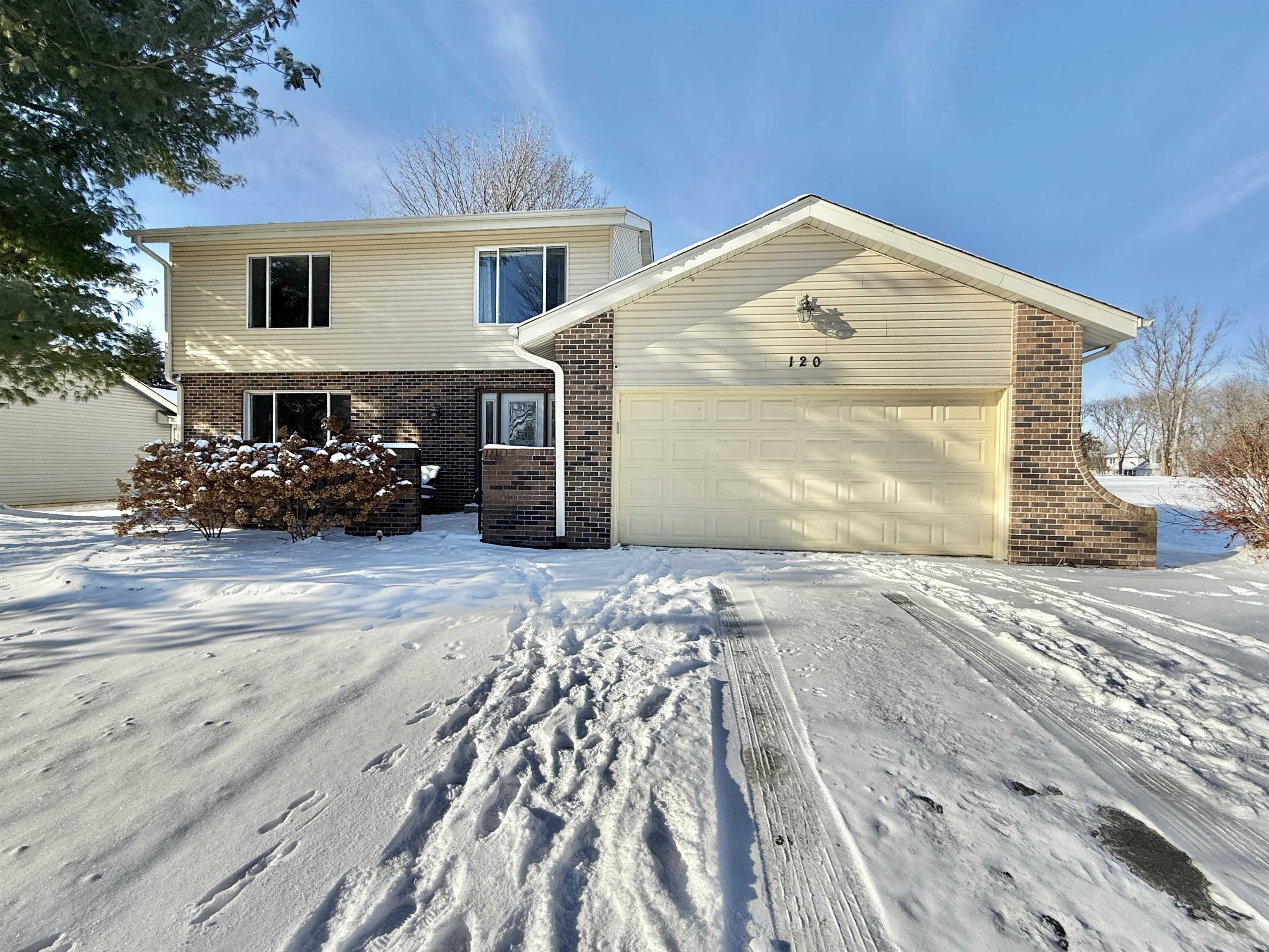 120 Lamplighter Loop Southeast Poplar Grove, IL 61065 - Photo 1 of 30 a front view of a house with a yard