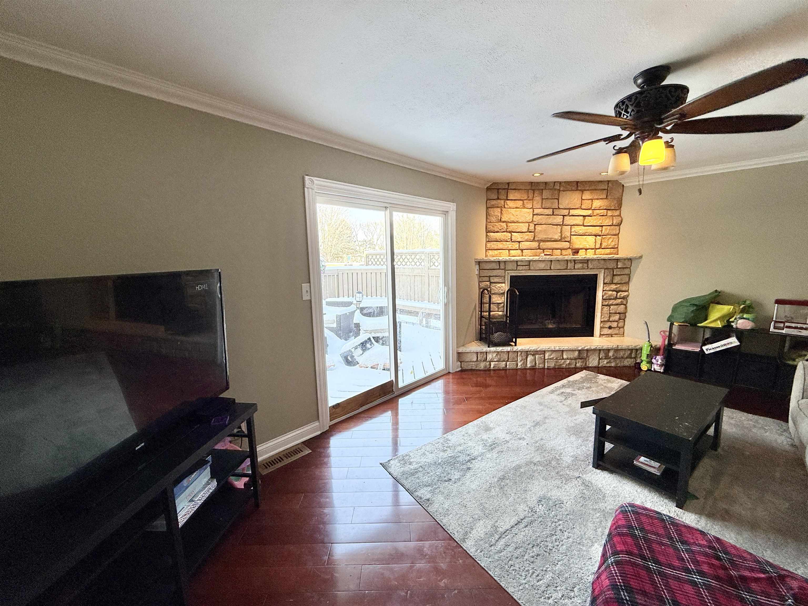 120 Lamplighter Loop Southeast Poplar Grove, IL 61065 - Photo 17 of 30 a living room with furniture rug and a fireplace