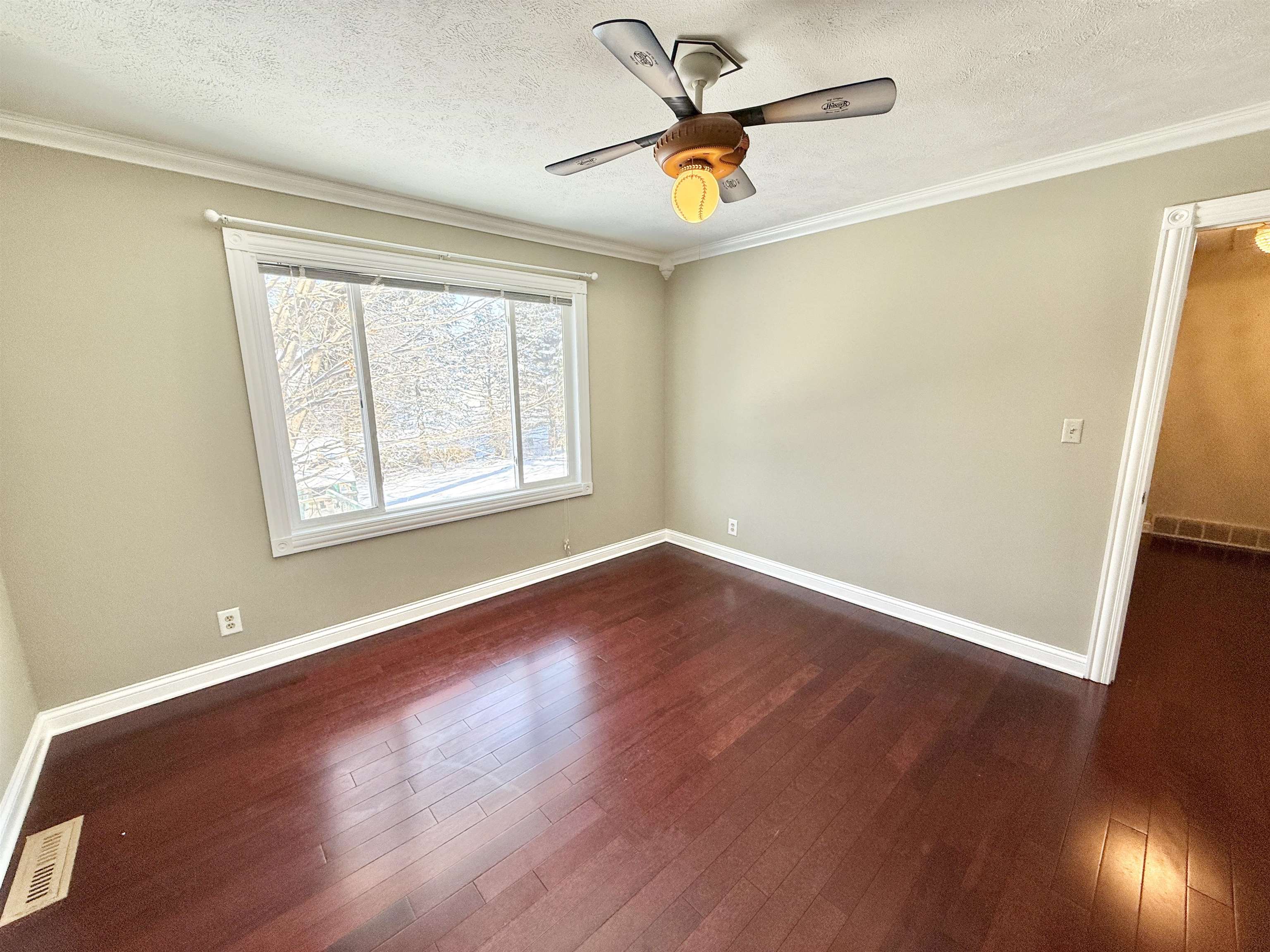 120 Lamplighter Loop Southeast Poplar Grove, IL 61065 - Photo 18 of 30 a view of an empty room with wooden floor and a window