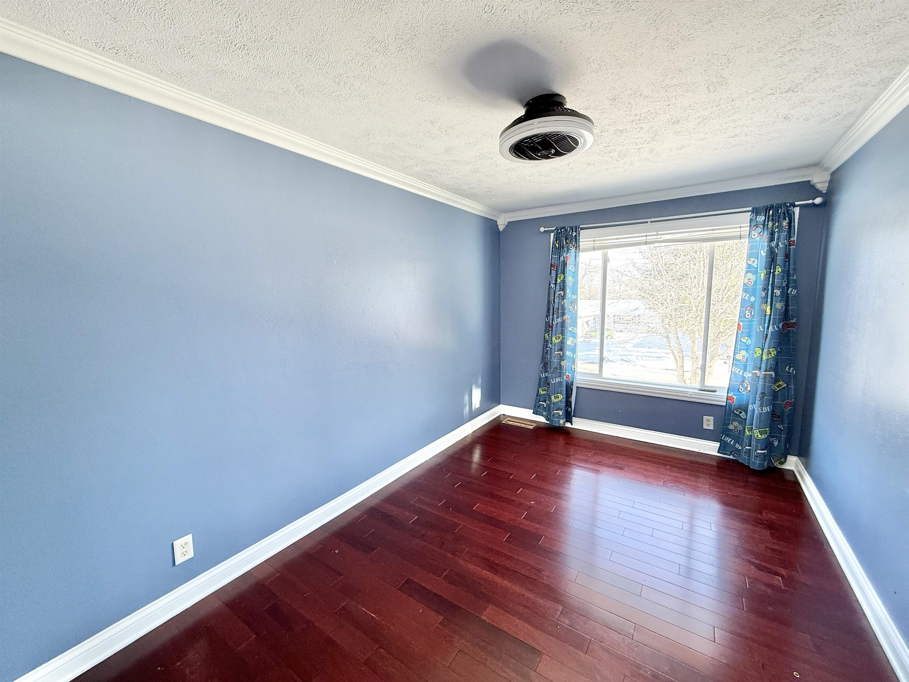 120 Lamplighter Loop Southeast Poplar Grove, IL 61065 - Photo 22 of 30 an empty room with wooden floor and windows