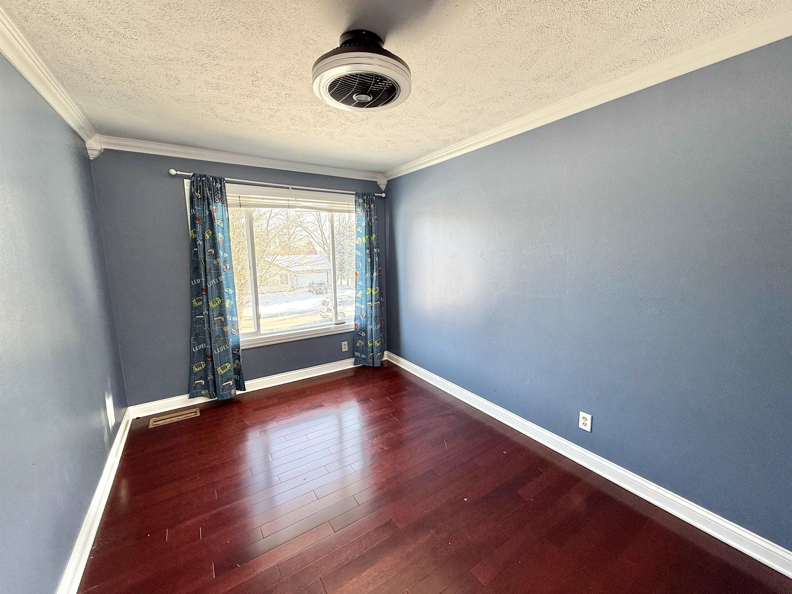 120 Lamplighter Loop Southeast Poplar Grove, IL 61065 - Photo 23 of 30 an empty room with wooden floor and windows